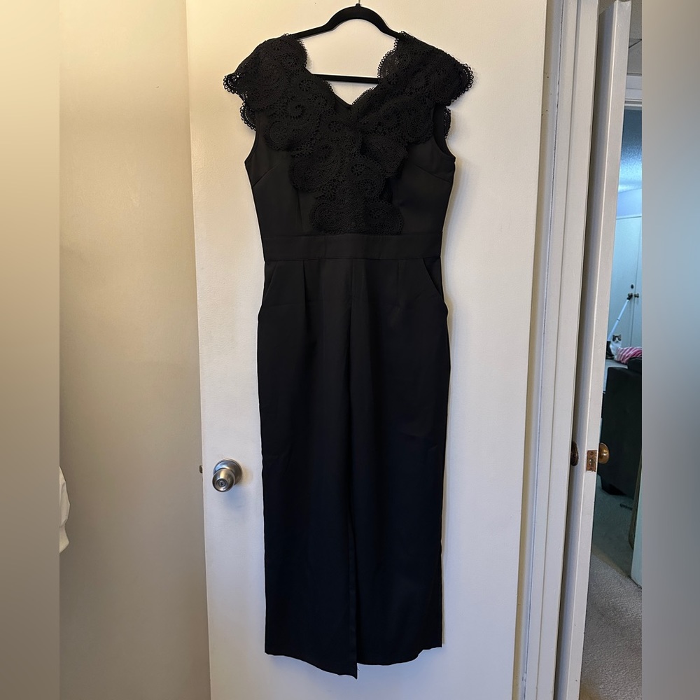 Black jumpsuit with lace neck detailing